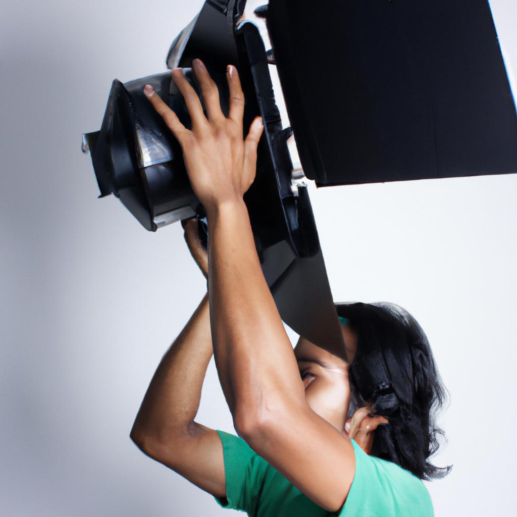 Person operating photography lighting equipment